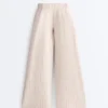 Wide-Leg Crop Trousers with Pleats and Stripes Wide-Leg Crop Trousers with Pleats and Stripes